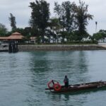 Image of Kusu Island, featuring serene beaches, clear waters, and lush greenery.