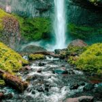 A breathtaking view of shimmering waters cascading down from the majestic peaks.