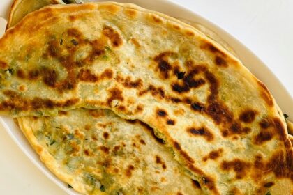 An image of crispy Amritsari Kulcha with chole served at a popular eatery in Ludhiana.