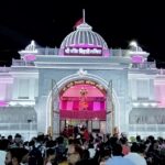 A frontal view of the Banke Bihari temple decorated with lights during nighttime