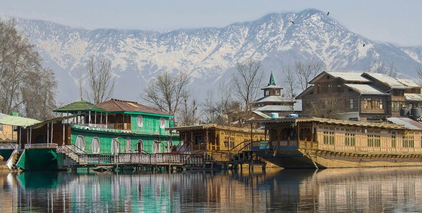 Houseboats on Dal Lake in Srinagar with several boats parked - Famous Lakes In Jammu And Kashmir