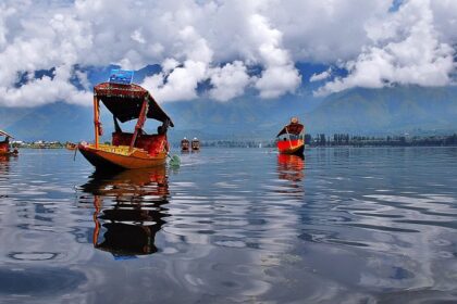 An image showcasing a serene view of the major lakes in India surrounded by beautiful landscapes.