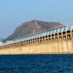 Serene scene of Vijayawada, showing the bridge amidst the greenery.